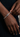 DOLA tennis bracelet featuring original African mask design in 18ct gold, inspired by West African art