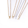 Abidí Initial Necklace – Gold Letter Pendant with African Mask Charm